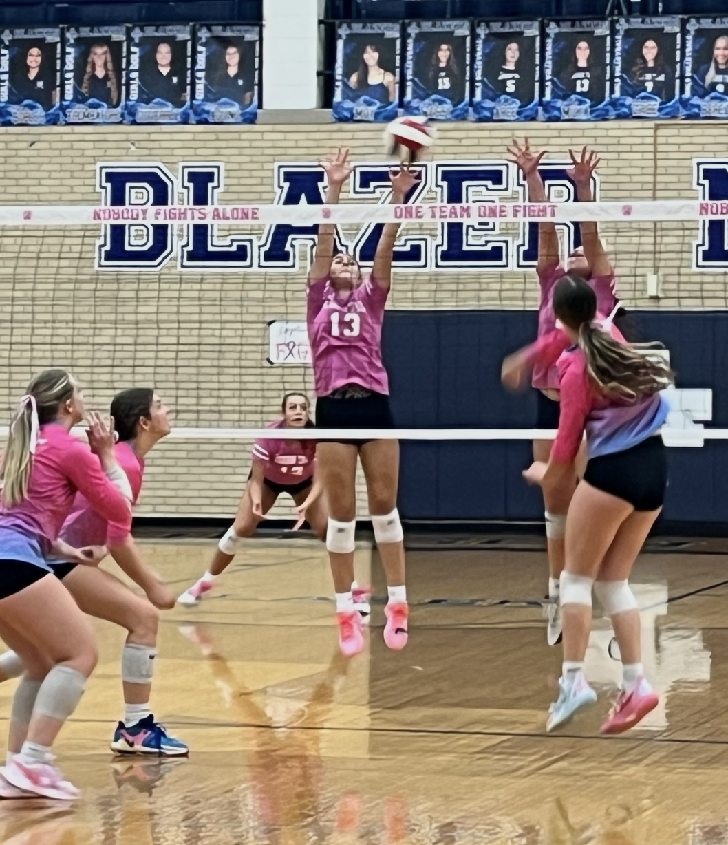 Addison Trail and Willowbrook face off for a cause during District 88’s annual Dig Pink girls volleyball match