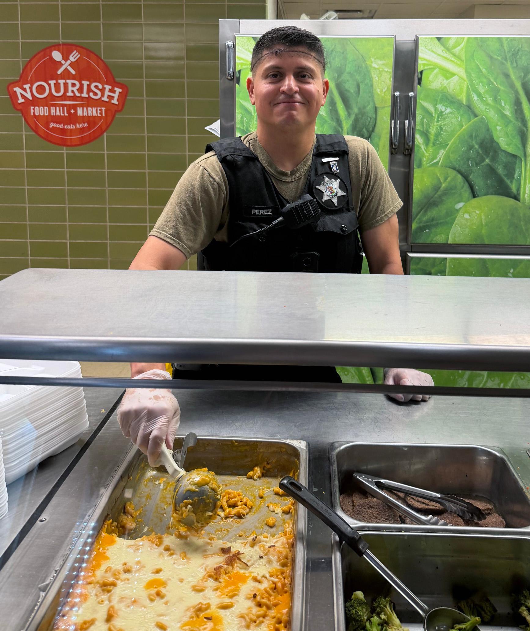 Willowbrook School Resource Officer (SRO) serves lunches to help strengthen relationships with students and staff